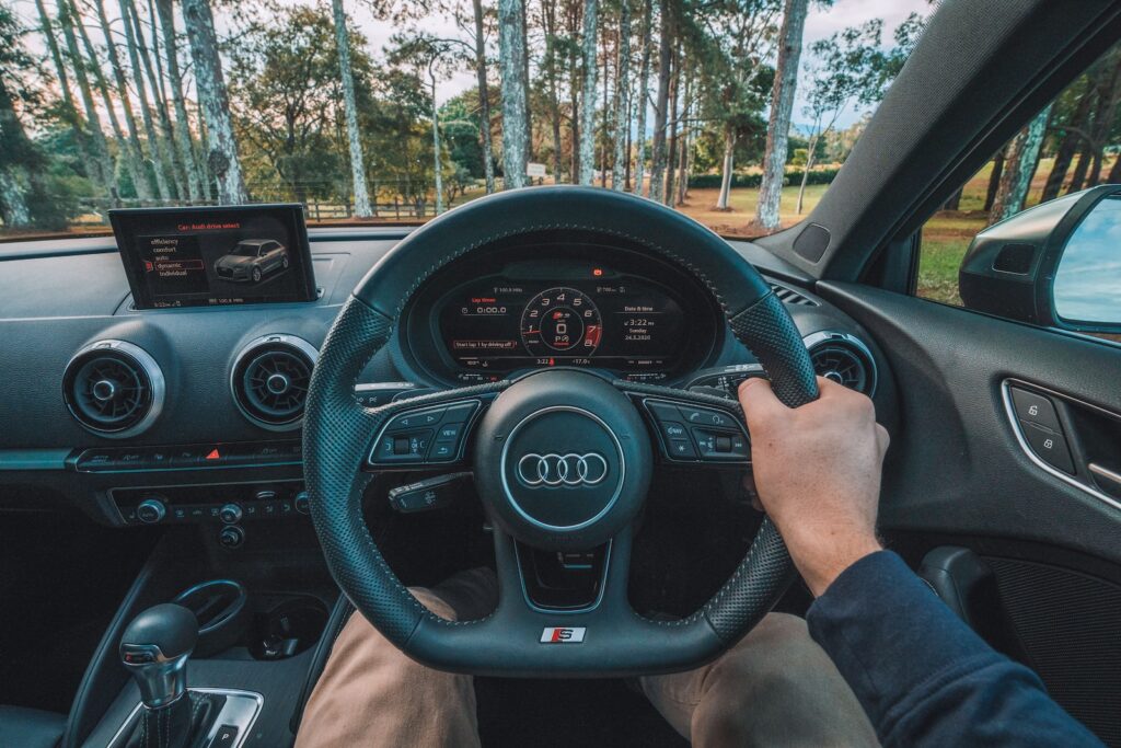 person driving car during daytime