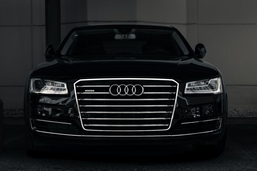 a black and white photo of an audi car